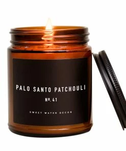 Sweet Water Decor Palo Santo Patchouli Soy Candle - Amber Jar - 9 Oz CANDLES + REEDS