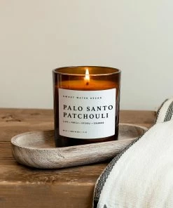 Sweet Water Decor Palo Santo Patchouli Soy Candle - Amber Jar - 11 Oz CANDLES + REEDS