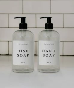 Sweet Water Decor 16oz Clear Plastic Countertop Dispenser Set Of 2- White Text Label SOAP DISPENSERS