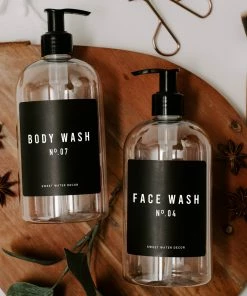 Sweet Water Decor 16oz Clear Plastic Body Wash Dispenser - Black Label SOAP DISPENSERS